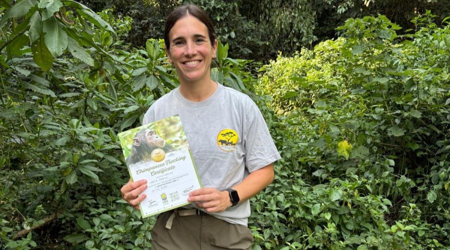 Our Guest with her Chimpanzee Tracking Certificate at Kibale Forest